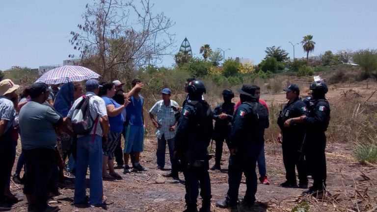 Intermedian policías en disputa por invasión en Culiacán